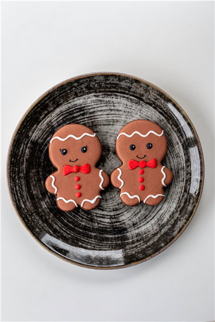 Gingerbread Cookies on Black Ceramic Plate by Pincalo