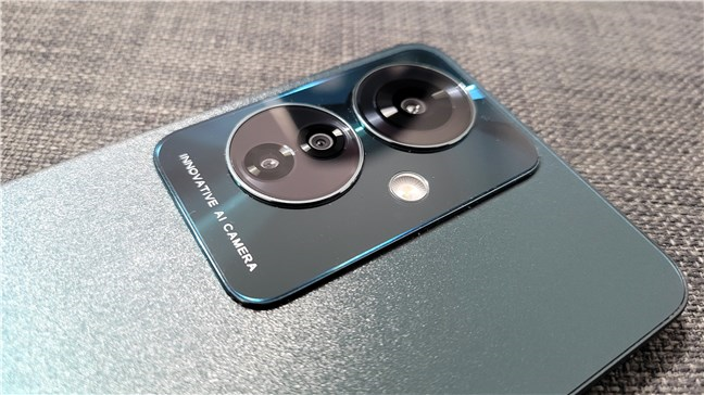 The phone has wide, ultrawide, and macro cameras on its back