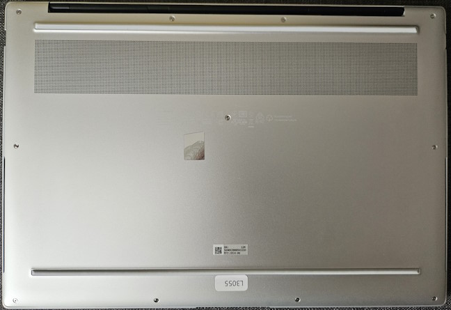 The bottom of the laptop features the speakers and the cooling vents