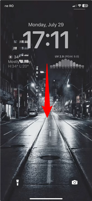 Swipe down in the middle of the Lock Screen for Spotlight Search