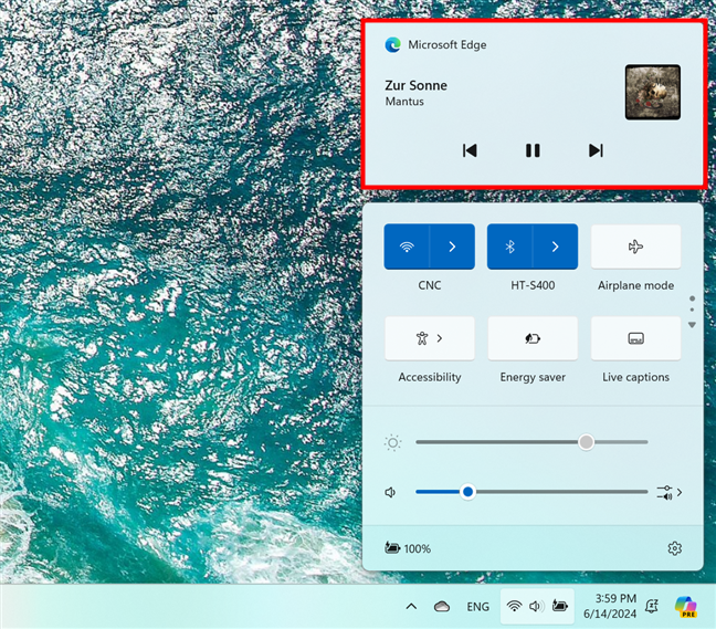 The media controls panel above the Quick Settings