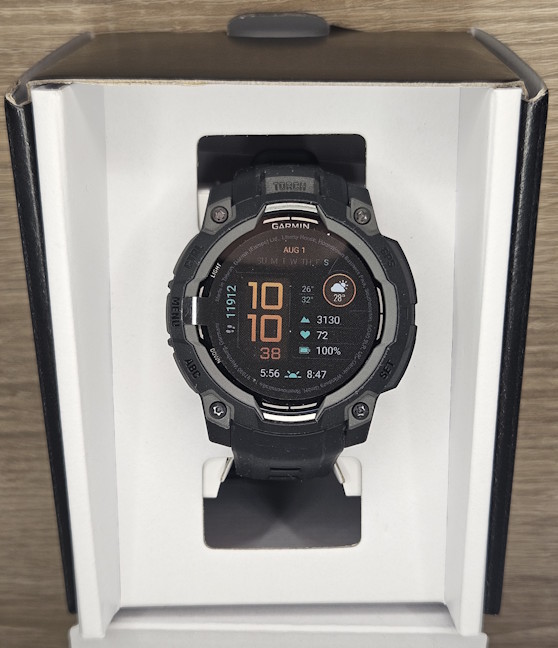 The Garmin Instinct 3 is hidden in an inner container